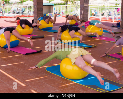 A Swiss Ball Pilates class at a holiday complex in Skala Eresou, Lesbos, Greece. Stock Photo