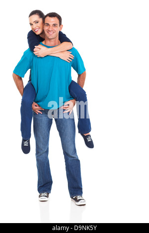 portrait of cheerful young couple piggyback over white background Stock Photo