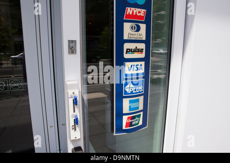 Multiple credit card brand label affixed to store entrance