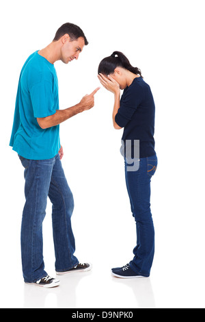 angry man pointing his crying girlfriend isolated on white background Stock Photo