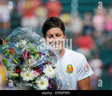 Rochester, New York, USA. 23rd June, 2013. Western New York Flash forward ABBY WAMBACH #20 receives flowers from her team for breaking Mia Hamm's record for the number of international goals scored. The Seattle Reign FC tied the Western New York Flash 1-1 at the at Sahlen's Stadium. ©csm/Alamy Live News Stock Photo