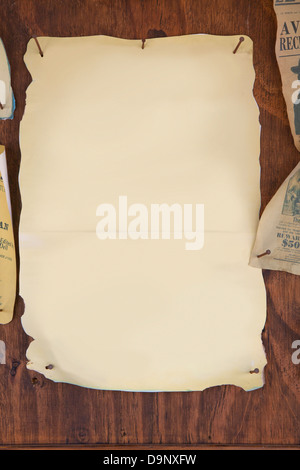 old papers on a wooden wall Stock Photo