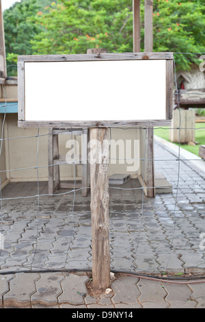 empty wooden sign post on garden Stock Photo