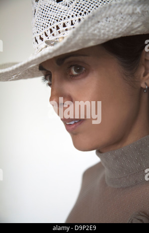 Woman in White Straw Stetson Stock Photo