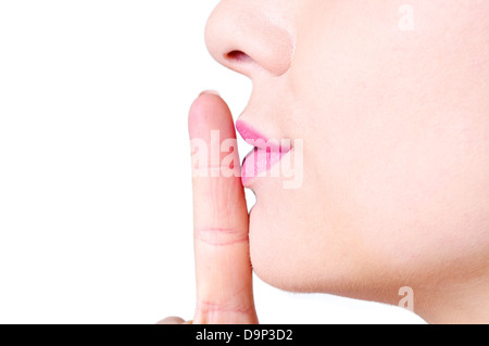 A young female making a sign to keep quiet. Stock Photo
