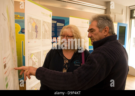 Local residents perusing plans for new eco town at Eco Station, Bordon, Hampshire, UK. Stock Photo