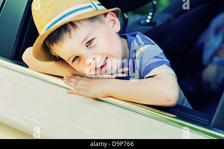 Cute little boy bored in the car Stock Photo