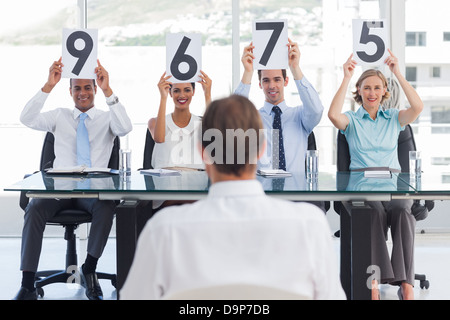 Job applicant getting marks Stock Photo
