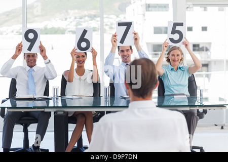 Sitting job applicant getting marks Stock Photo
