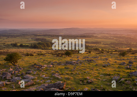 Sunset from Pew Tor with views over the Devon countryside. Dartmoor national park Devon Uk Stock Photo