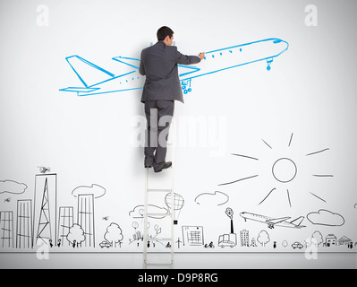 Businessman standing on ladder drawing airplane above town Stock Photo