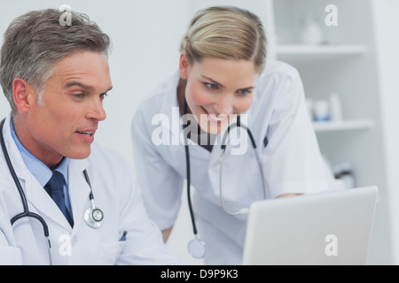Two doctors watching a laptop Stock Photo