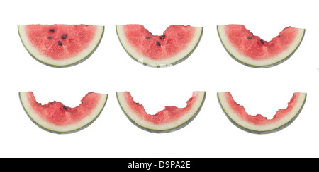 Different stages of a slice of watermelon being eaten isolated on white background Stock Photo