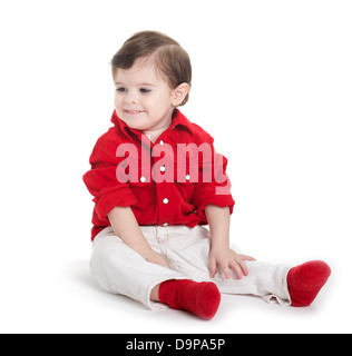 Toddler baby sitting and looking away Stock Photo