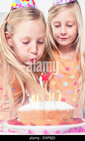 Little girl blowing her candles Stock Photo