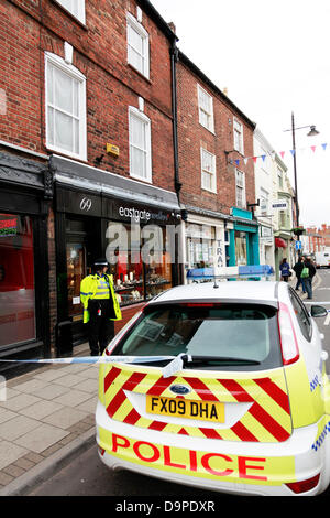 Louth, Lincolnshire, UK. 24th June, 2013. Armed robbery at Eastgate Jewellers in Louth, Lincolnshire UK England on 24/06/2013 at midday. Two men on a motorbike armed with a knife and a sledge hammer smashed the door and counter display and made off with jewellery. One has been arrested but one is still at large Credit:  Paul Thompson Live News/Alamy Live News Stock Photo