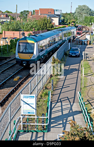 A diesel multiple train approaching Woodbridge Railway Station on the East Suffolk Line in England Stock Photo