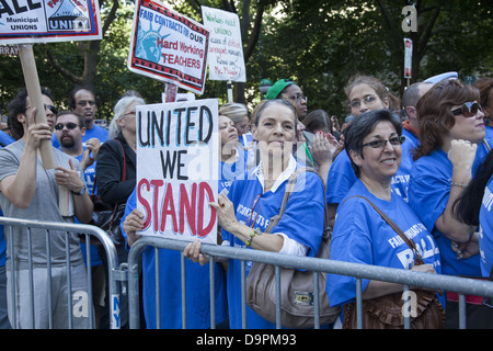 Unionized city workers from varied professions, FDNY, teachers, nurses etc rally at city hall for fair contracts with NY City. Stock Photo