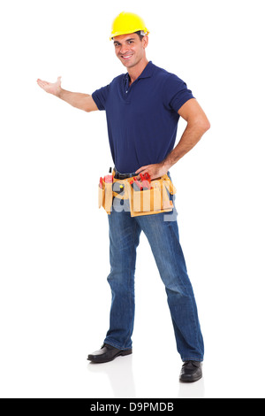 portrait of cheerful handyman presenting over white background Stock Photo