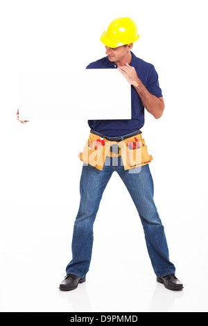 male builder holding a white board isolated on white Stock Photo