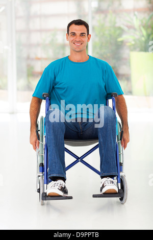 optimistic handicapped man sitting on wheelchair Stock Photo