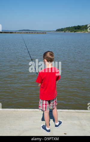 Young boy fishing on a dock Williamsburg, Virginia, USA Stock Photo