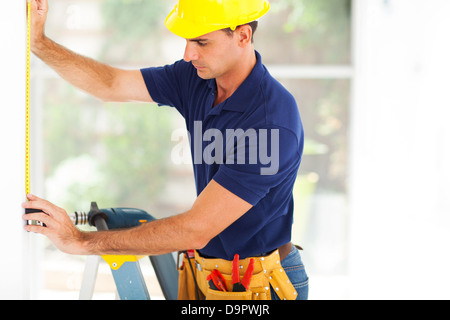 professional cctv guy installing security camera Stock Photo