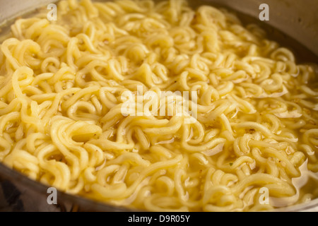 Instant Ramen cooking in a pot Stock Photo