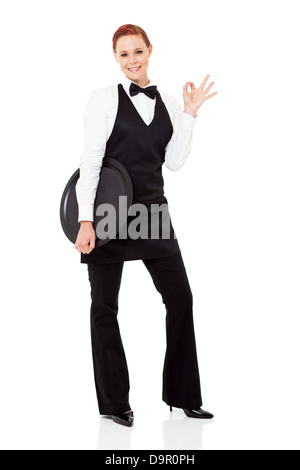 cute young waitress giving ok hand sign isolated on white Stock Photo