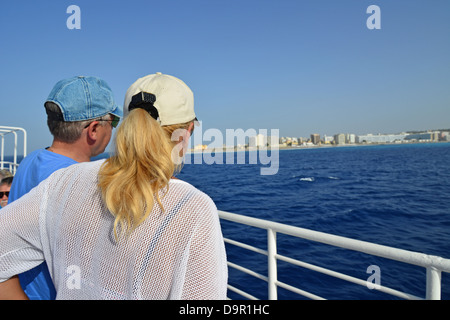 Couple on ferry to Symi from City of Rhodes, Rhodes (Rodos), The Dodecanese, South Aegean Region, Greece Stock Photo