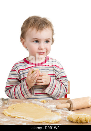 cute child with dough and rolling pin isolated on white background. horizontal image Stock Photo