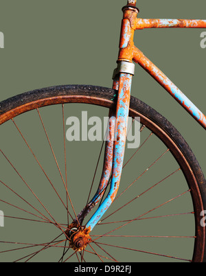 Old rusty bicycle, isolated on green