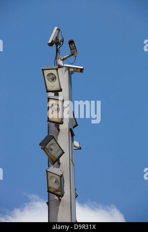 Surveillance cameras and floodlights on top of the pole Stock Photo