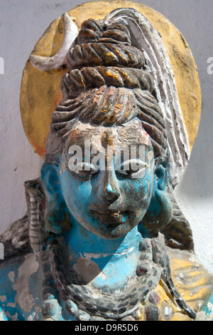 A figurine if the Hindu God Shiva sits at a shrine in the tribal district of Bharmour, Himachal Pradesh, India Stock Photo