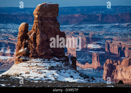 a rock stack in the region of the petrified sand dunes with the Courthouse Towers beyond, Arches National Park, Utah, USA Stock Photo