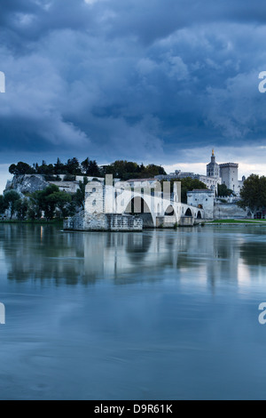 the Pont St-Bénézet, Palais des Papes & Rhone River at dusk, Avignon, Provence, France Stock Photo