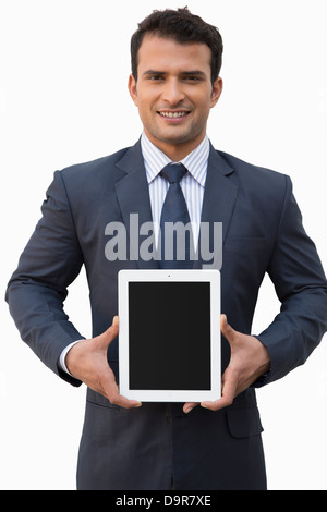 Portrait of a smiling businessman holding a digital tablet Stock Photo