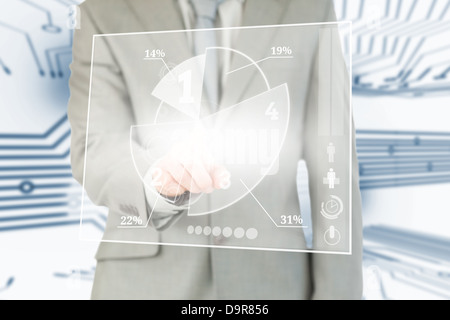 Businessman using transparent futuristic interface Stock Photo