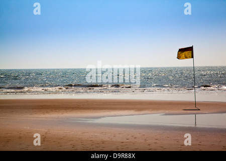 Flag on the beach, Morjim, Pernem, Goa, India Stock Photo