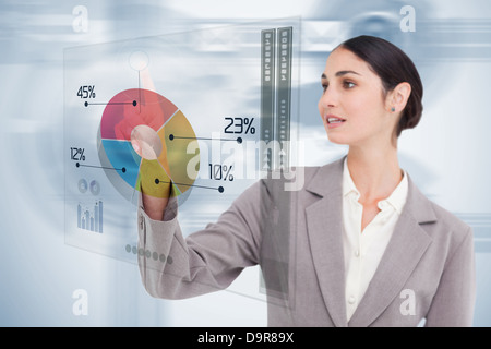 Businesswoman using colorful futuristic interface Stock Photo
