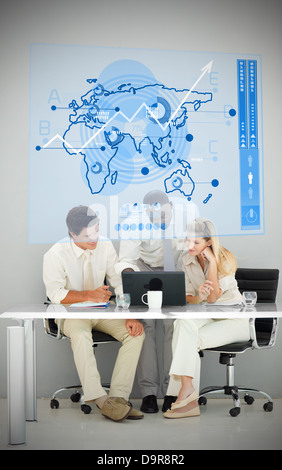 Three business people using blue map diagram interface Stock Photo