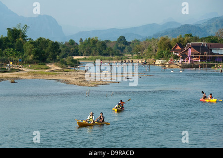 Horizontal view of activities on the Nam Song river in Vang Vieng. Stock Photo