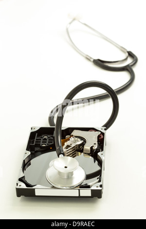 Disk drive with stethoscope resting on it Stock Photo