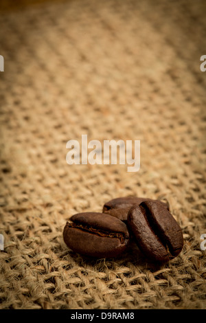 Three coffee beans with copy space Stock Photo - Alamy