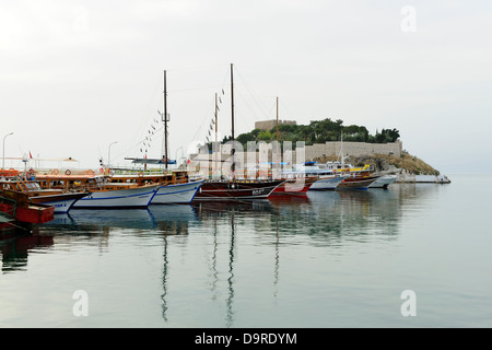 Boats moored on the causeway leading to Pigeon Island at Kusadasi, Aegean Coast, Turkey Stock Photo