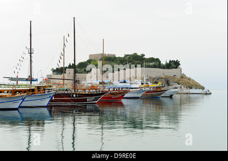 Boats moored on the causeway leading to Pigeon Island at Kusadasi, Aegean Coast, Turkey Stock Photo