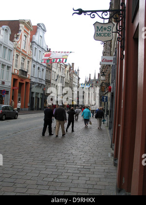Shops along cobbled sidewalk, Bruges, West Flanders, Belgium Stock Photo