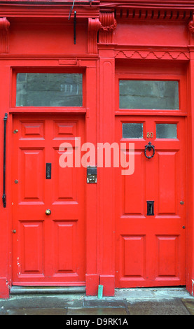 Red front doors, Bath, UK. Stock Photo