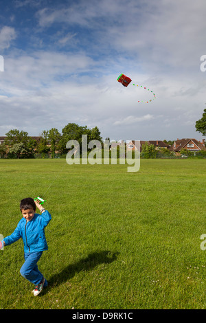 Young boy flying a kite Stock Photo