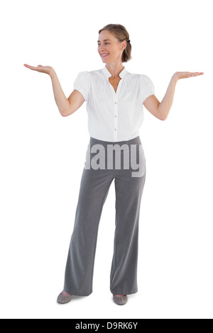 Businesswoman presenting something with her two hands raised Stock Photo